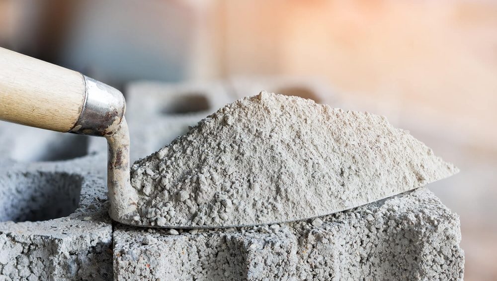 Hình ảnh xi măng dạng bột mịn xám, vật liệu kết dính trong xây dựng