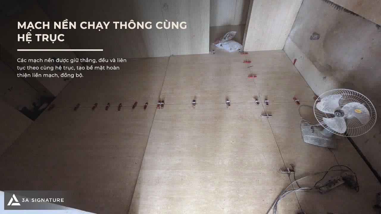 Hình ảnh ốp đá khổ lớn Legacy Penthouse thể hiện mạch nền chạy thẳng theo hệ trục, đồng bộ với bề mặt hoàn thiện.